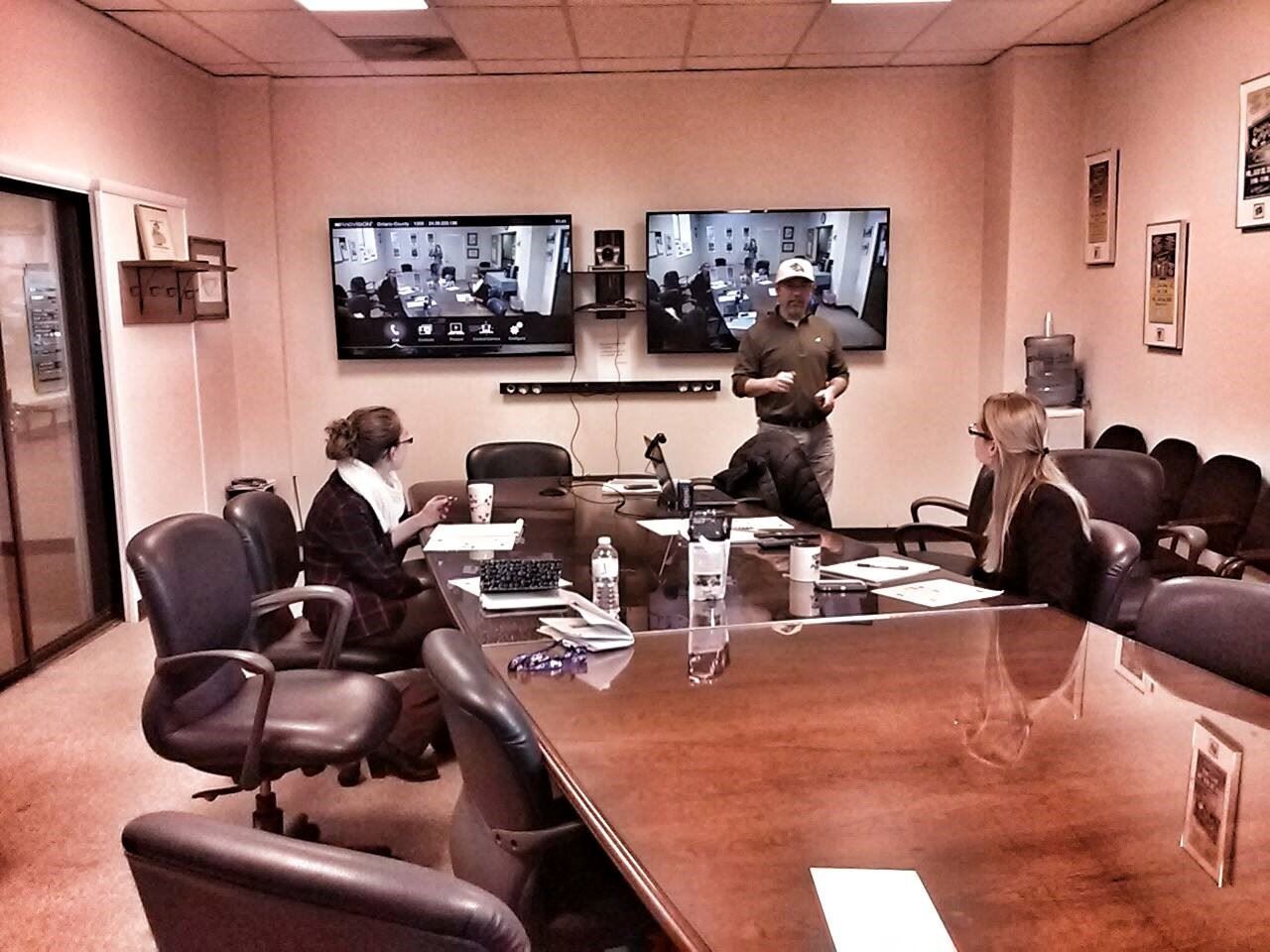 People Having Conference Call in Tech Space
